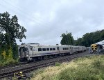 Comet V Cab Car # 6045 is on the point of Train # 1024 as it passes the URHS facility. GP40PH-2B # 4210 is seen on the left